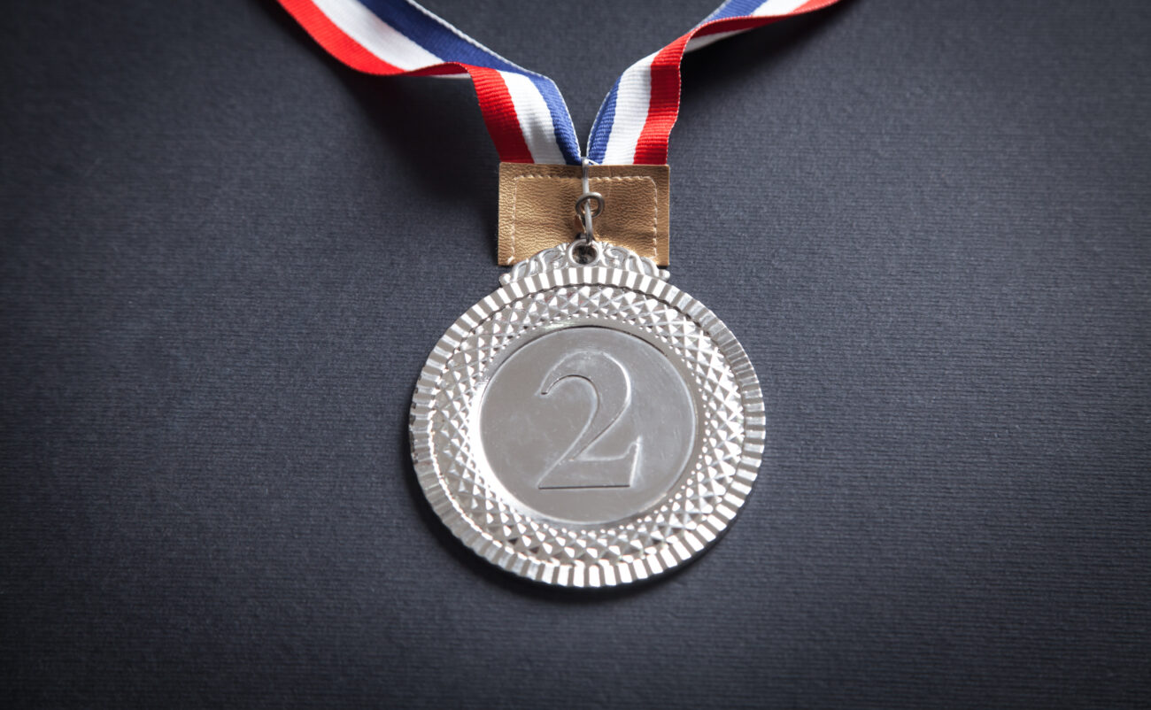 Silver Medal On Black Background.