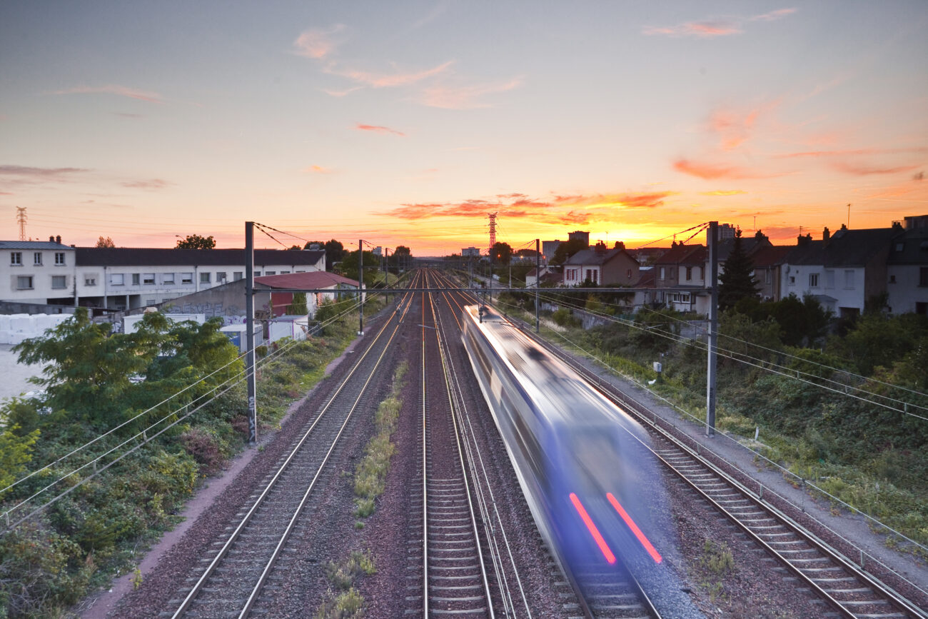 French Train Speeds Off Into The Sunset.