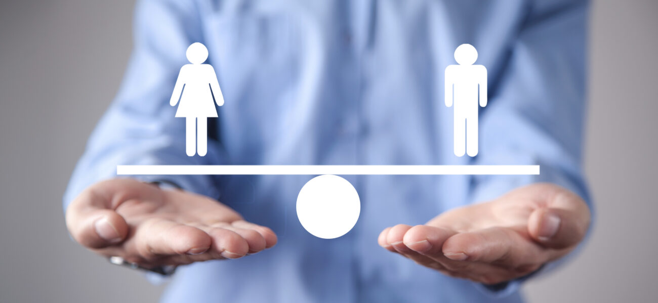 Man Showing Balance Scale. Man And Woman Equality