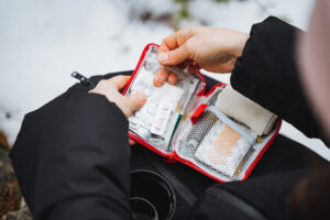 Gesture Of Holding A First Aid Kit For Automotive Travel Events