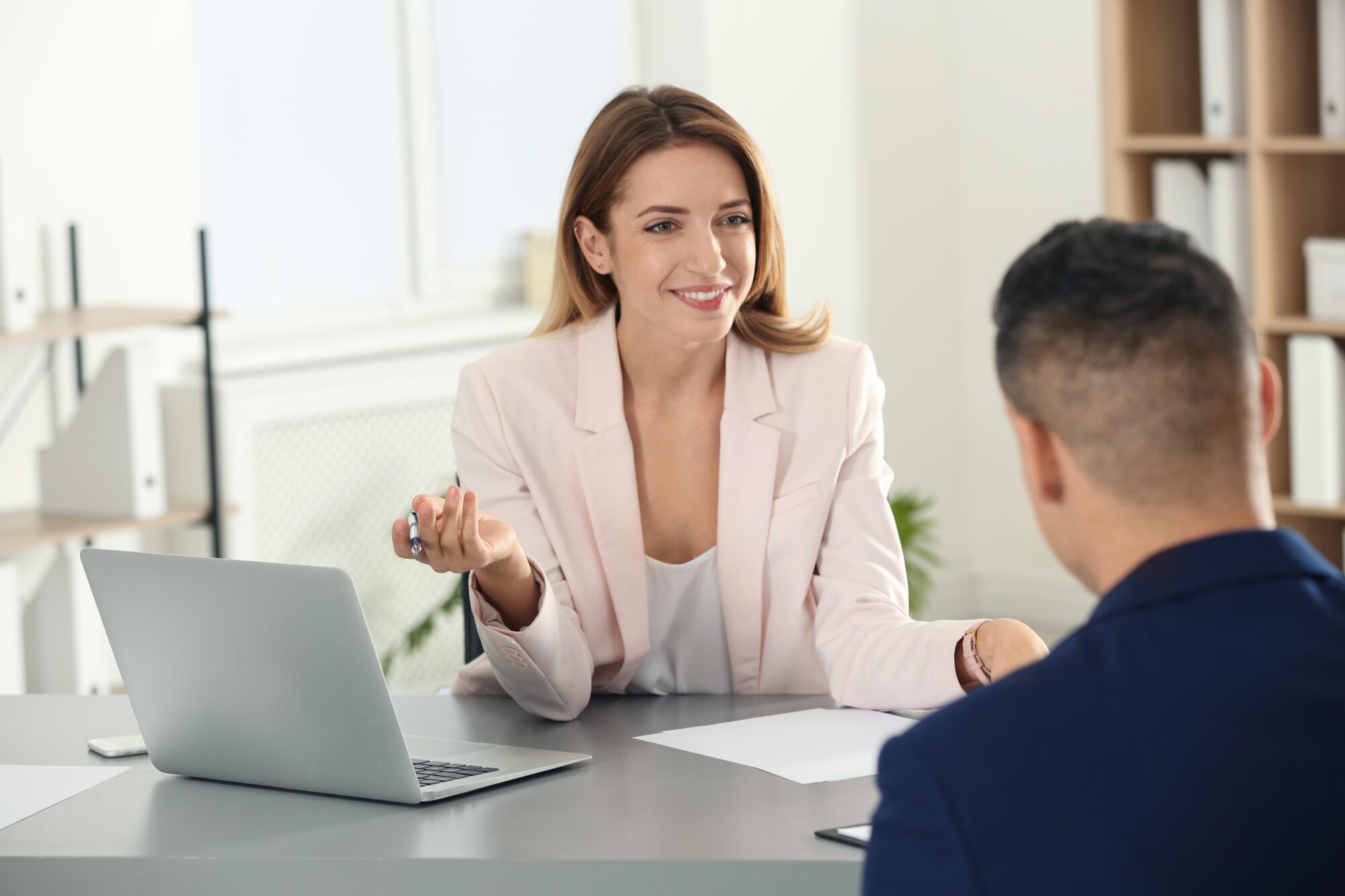 Human Resources Manager Conducting Job Interview With Applicant