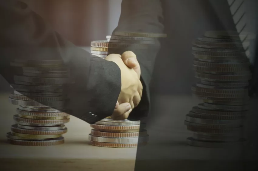 Double Exposure Businessman Shaking Hand And Money Coins, Concept In Corporate And Communicate To Success And Negotiate In Finance