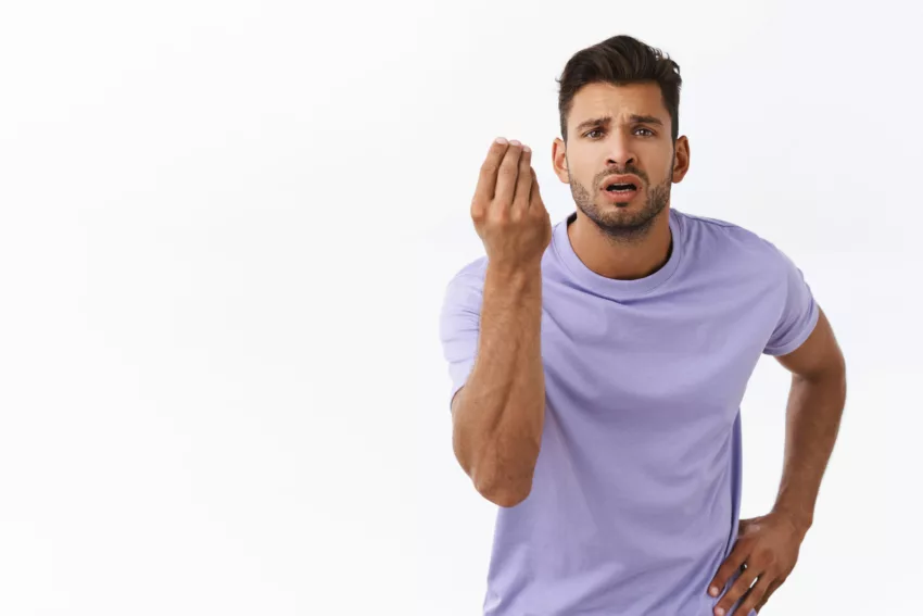 Pissed Sexy Guy With Beard In Purple T Shirt Shaking Fingers In Italian Gesture