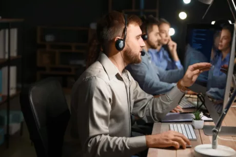 Technical Support Agents Working In Office At Night