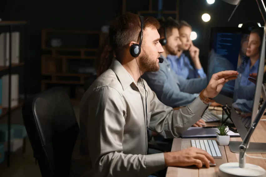 Technical Support Agents Working In Office At Night